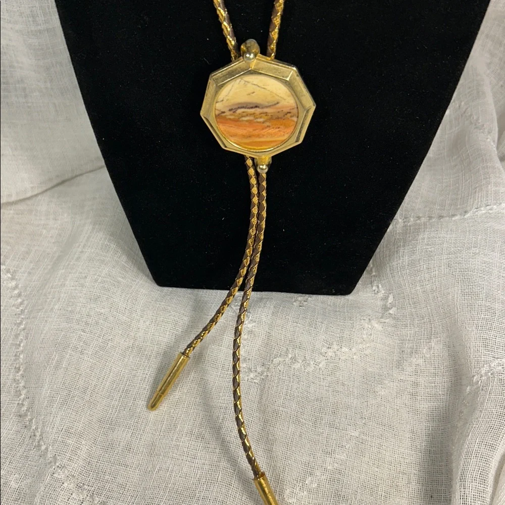 Vintage Bolo tie western leather, with ornate medallion, space for silver dollar